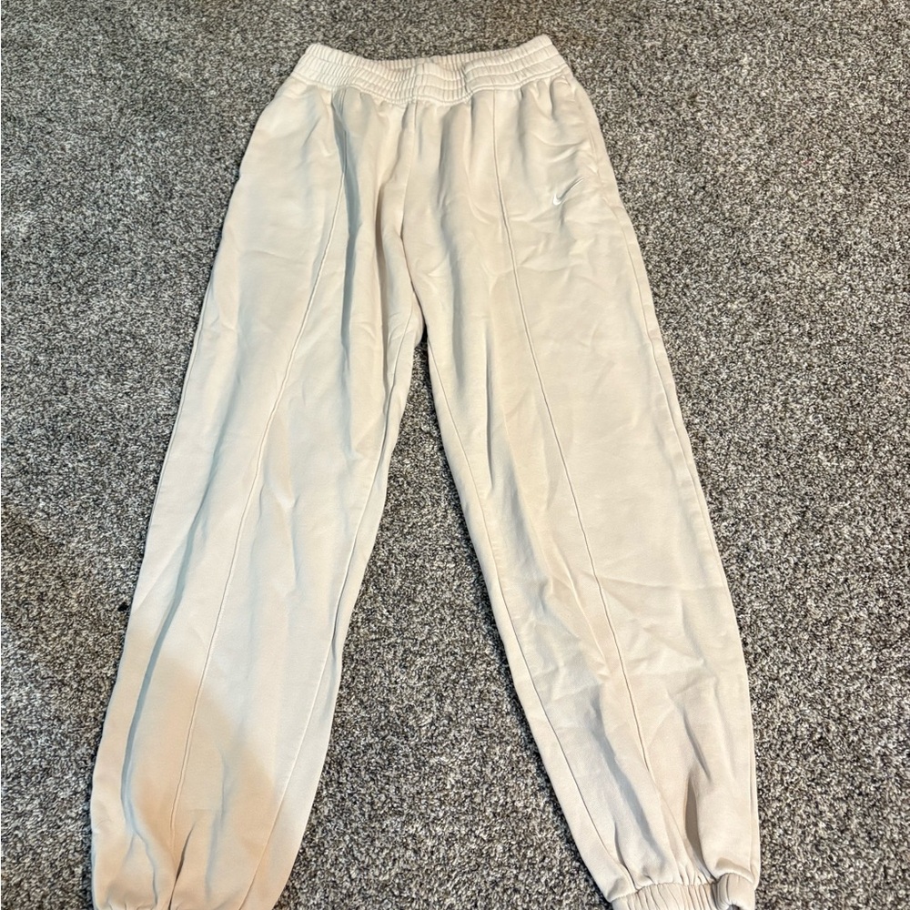 Nike Women's Cream Sweatpants small stain below waistband